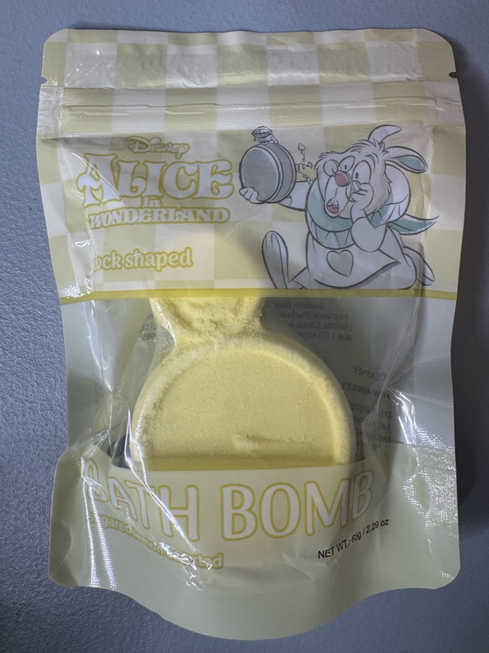 Disney Alice in Wonderland Pale Yellow Round Bath bomb shaped in a clock sugar